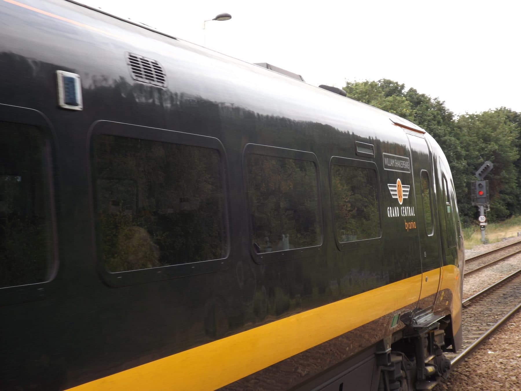 Grand Central Class 180 'William Shakespeare' Adelante train in its black and orange livery